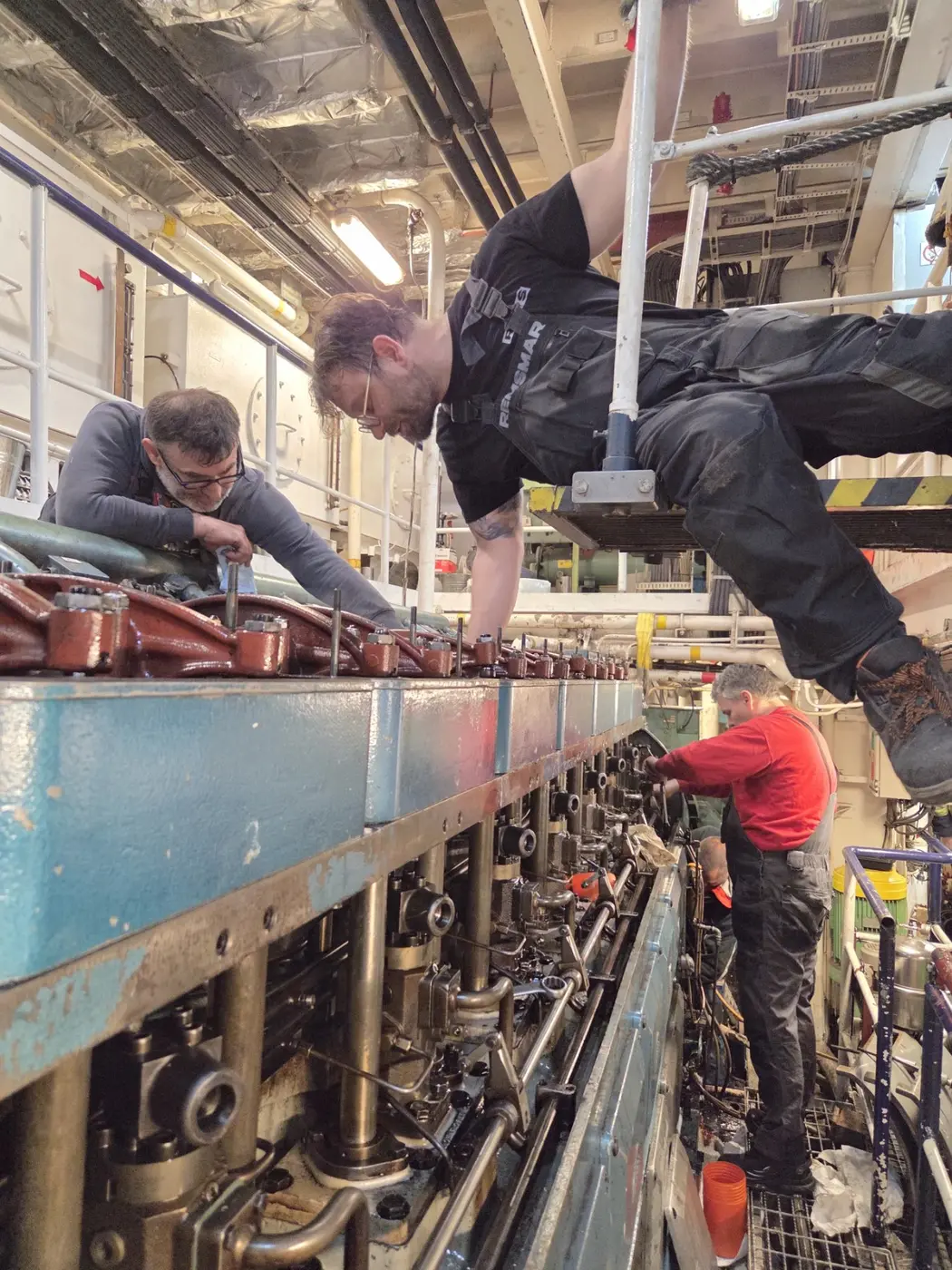 REMSMAR crew performing an engine overhaul on board a vessel